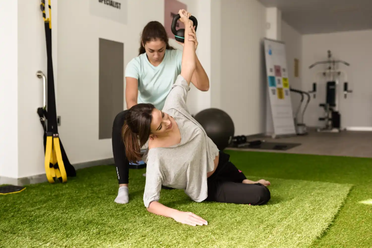 Physiotherapist providing hands-on back pain treatment